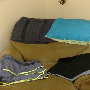 Bundle of four size large tennis skirts